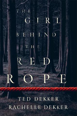 Girl behind red rope
